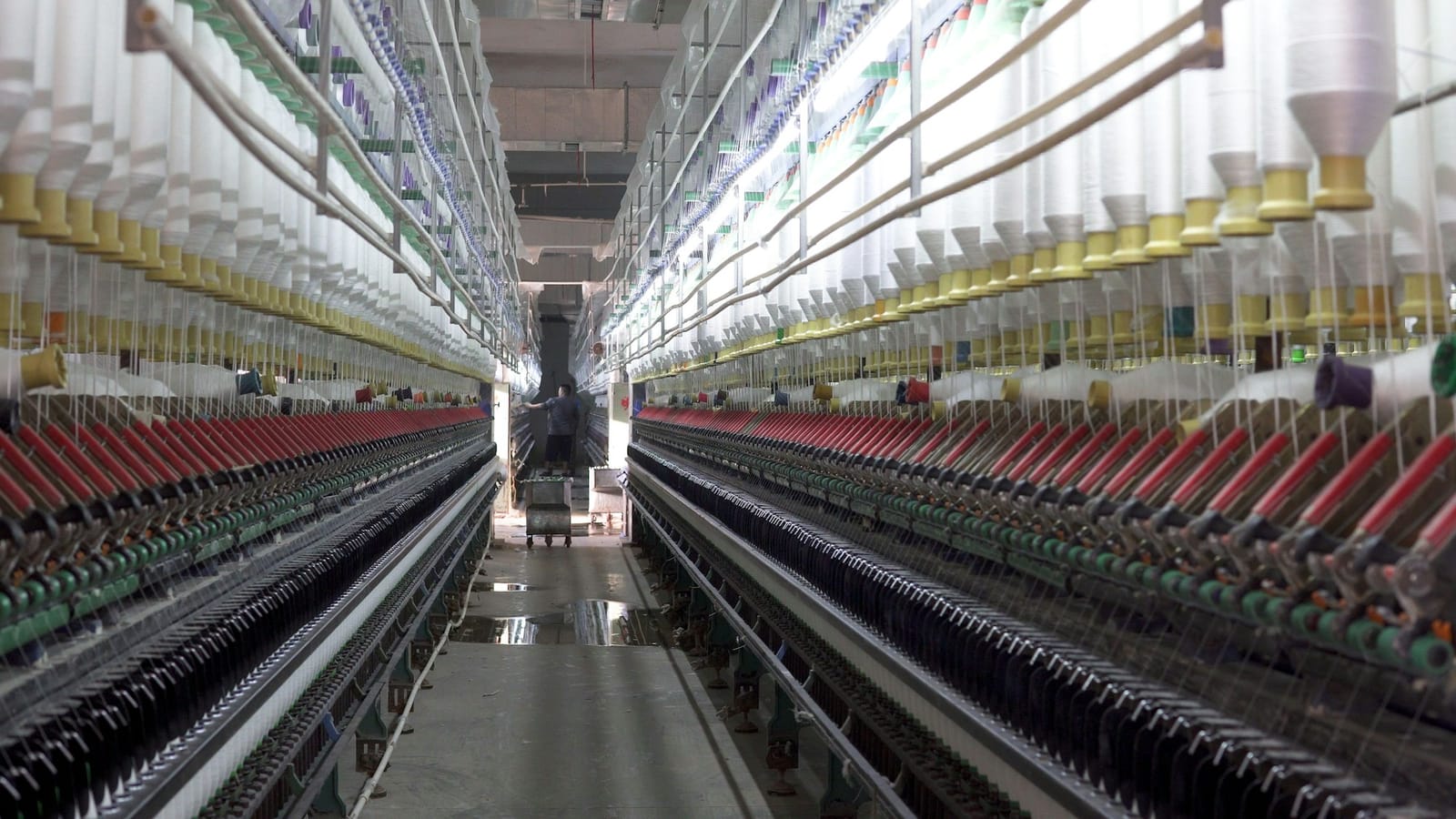 Modern spinning hall with long rows of ring spinning frames