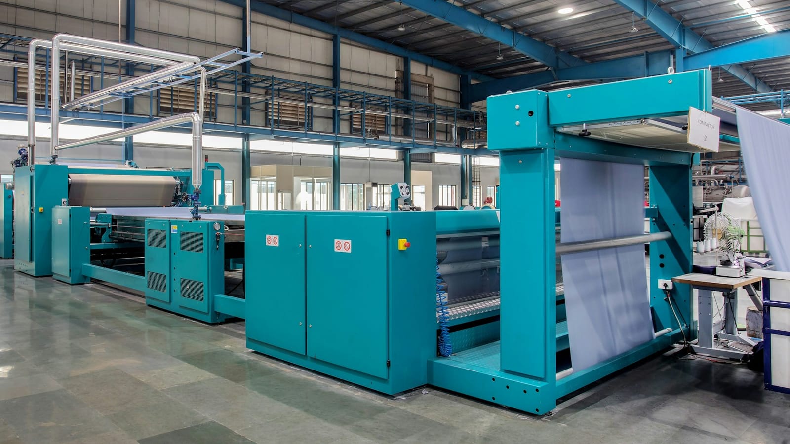 Modern textile plant with rows of finishing machines